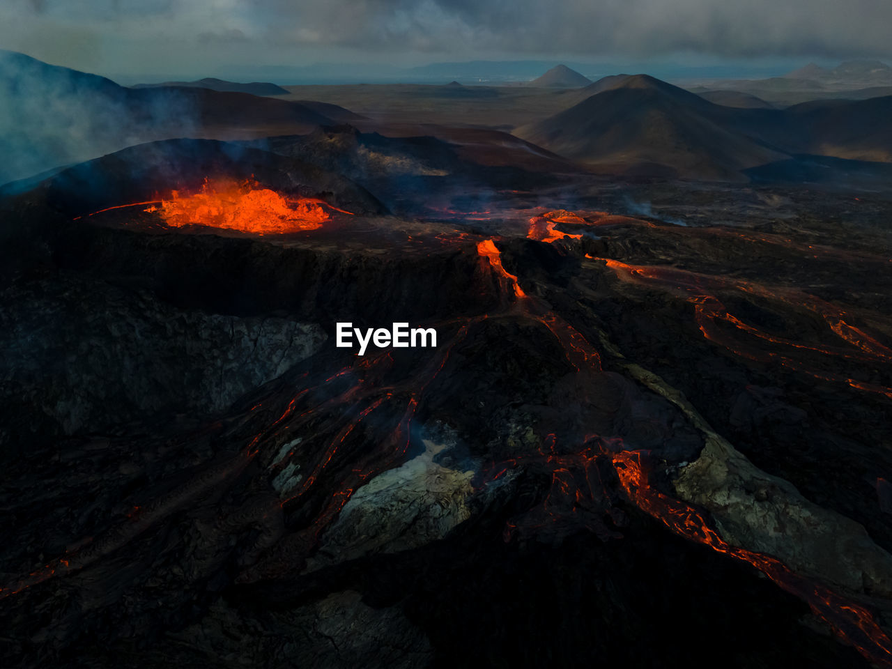 Aerial view of snowcapped mountains against sky