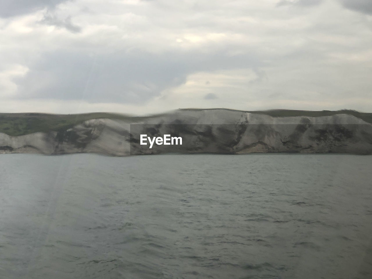 SCENIC VIEW OF SEA AND LANDSCAPE AGAINST SKY