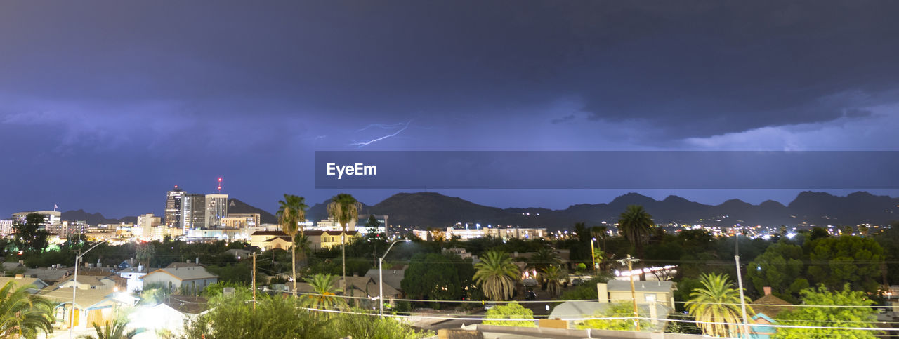 PANORAMIC VIEW OF LIGHTNING OVER BUILDINGS IN CITY