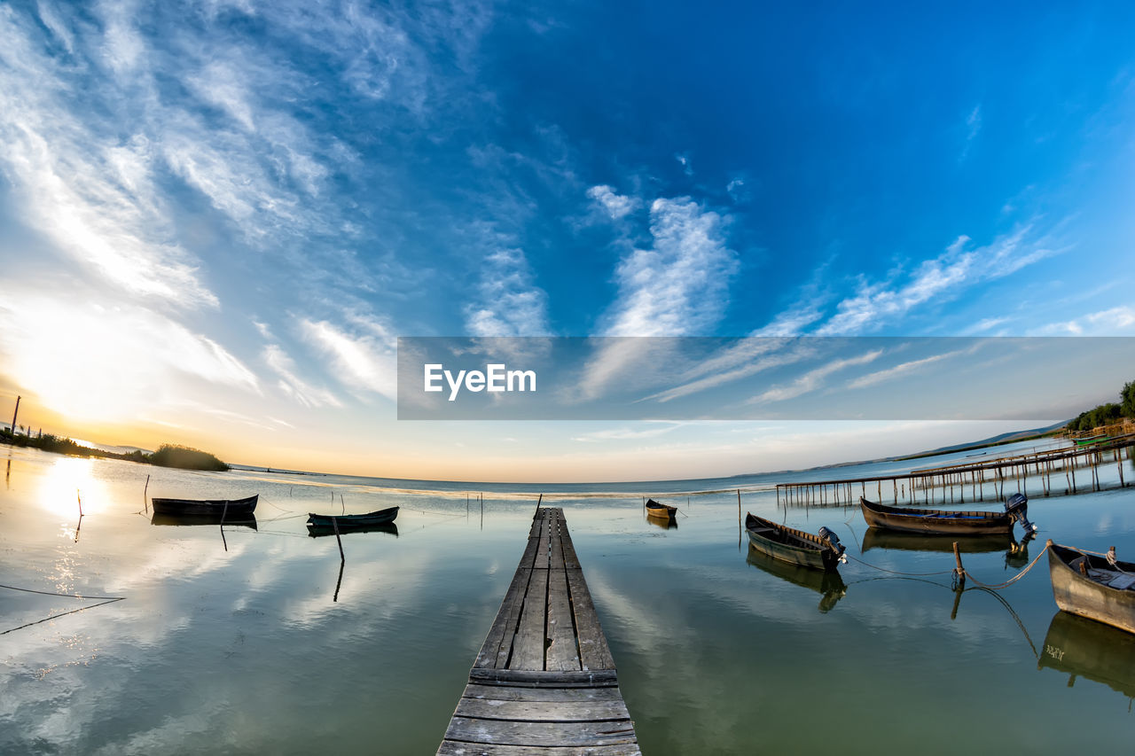 SCENIC VIEW OF WOODEN PIER AGAINST SKY