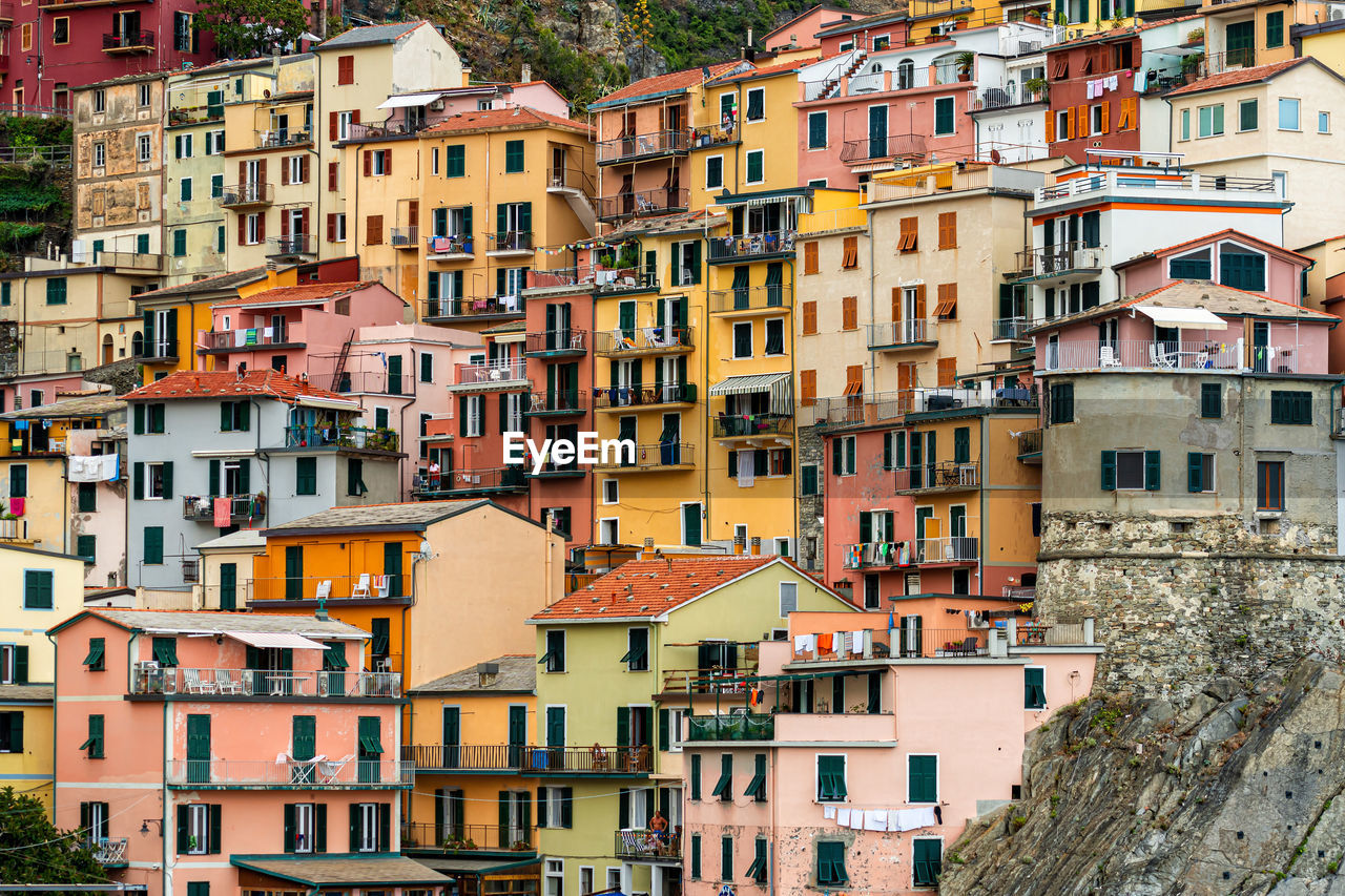 Scenic view of colorful houses in cinque terre village riomaggiore, manarola, italy