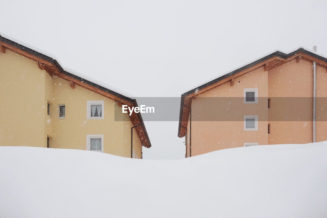 HOUSES AGAINST CLEAR SKY