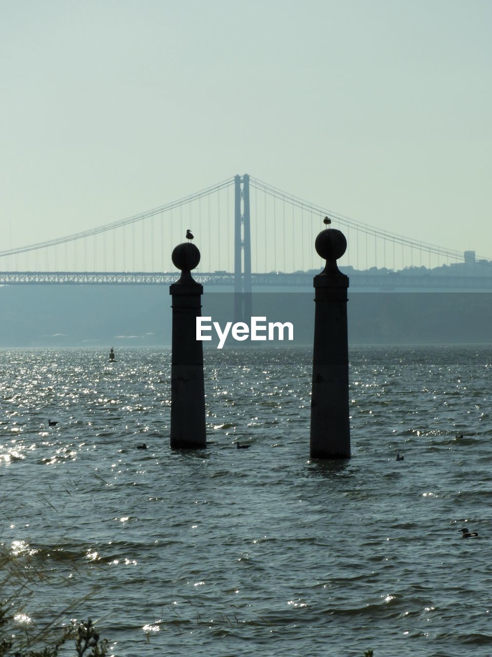 VIEW OF BRIDGE OVER SEA AGAINST SKY