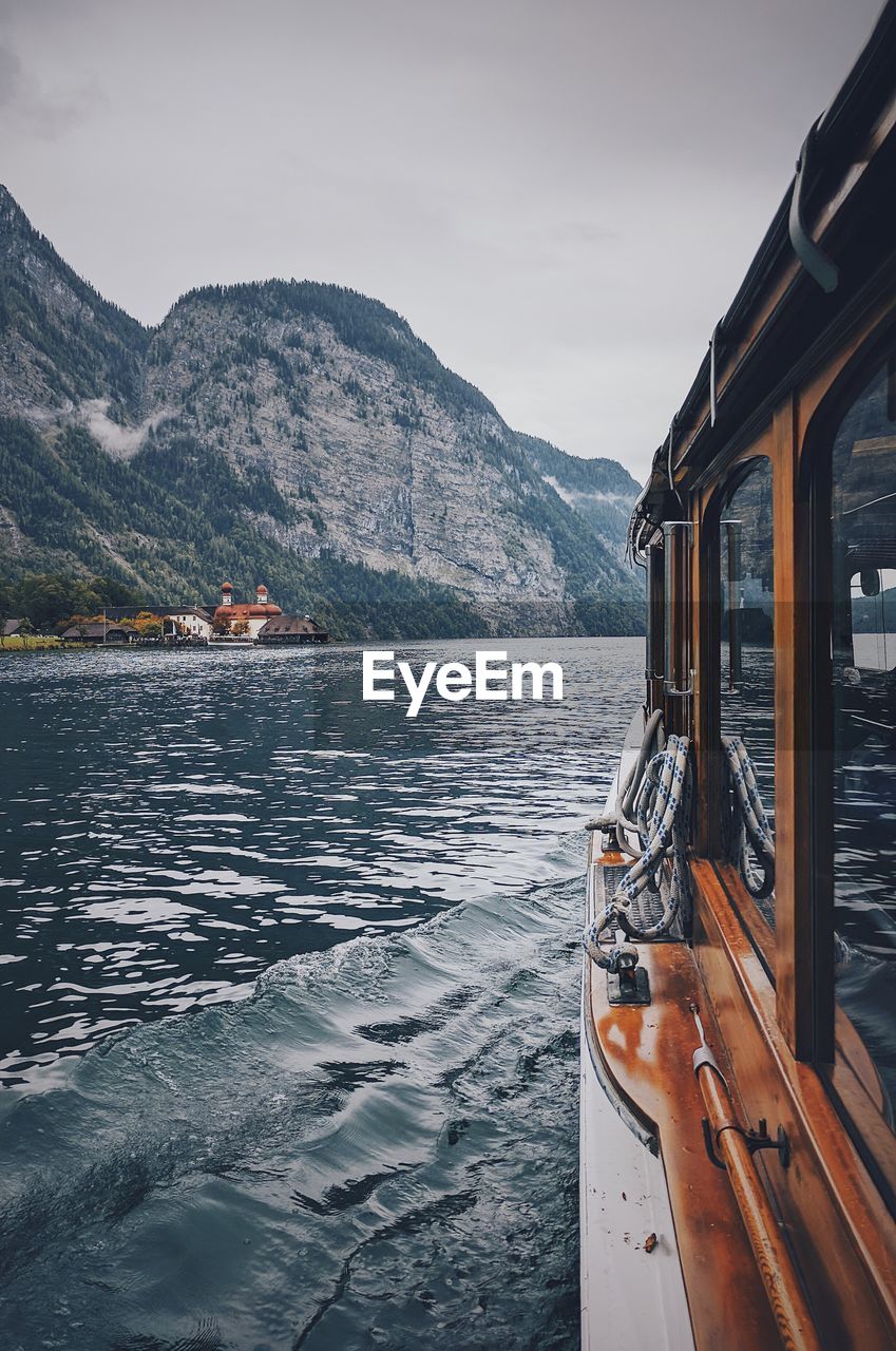 Boat on river against sky