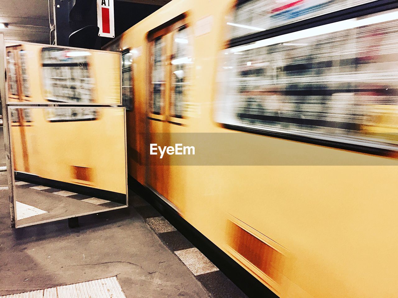 Blurred motion of train at railroad station