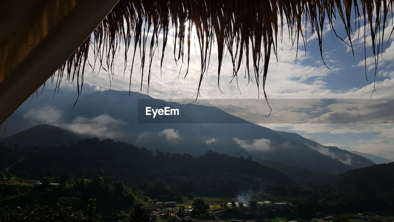 SCENIC VIEW OF MOUNTAINS AGAINST SKY DURING SUNSET