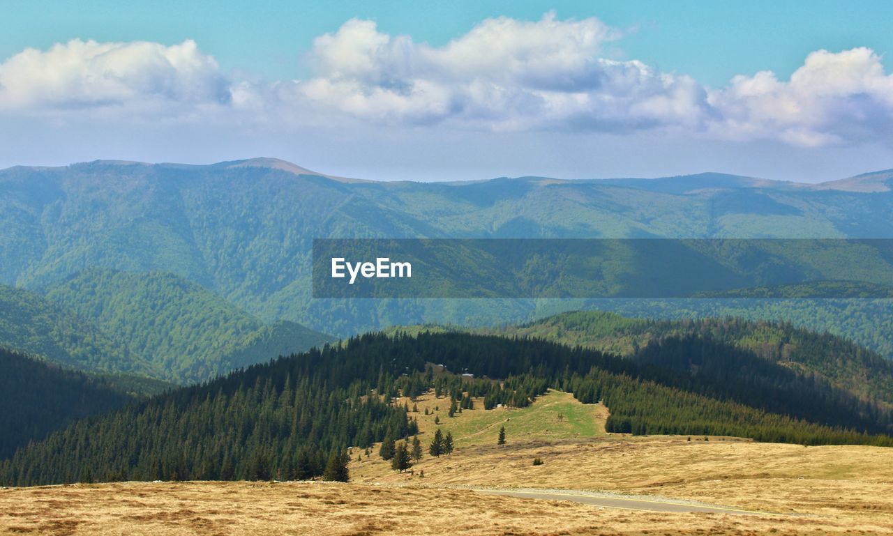 SCENIC VIEW OF MOUNTAIN AGAINST SKY