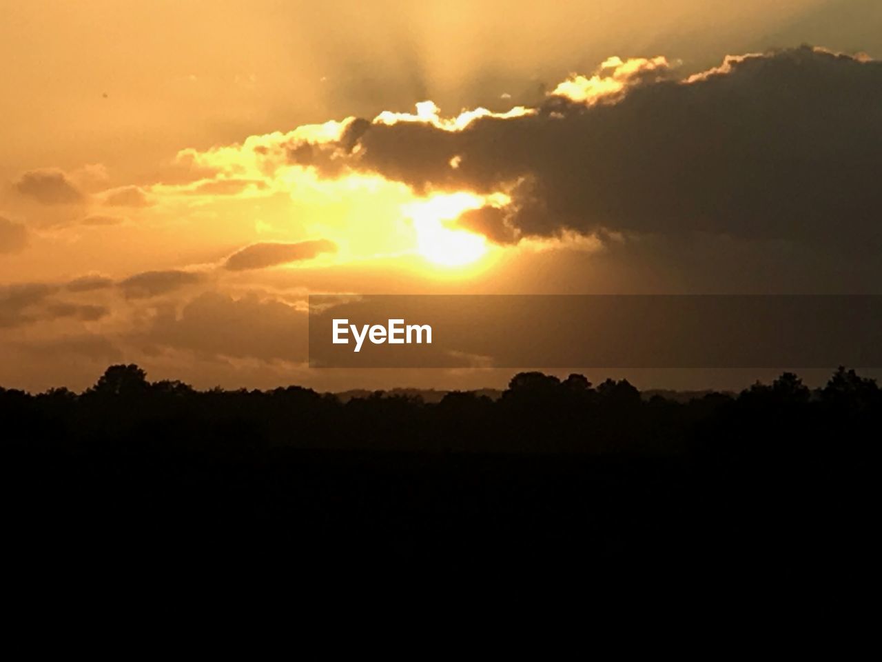 SCENIC VIEW OF SILHOUETTE LANDSCAPE AGAINST SKY AT SUNSET