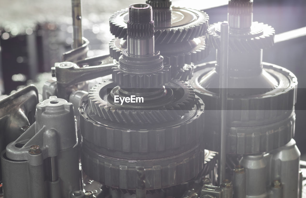 CLOSE-UP OF MACHINE PART OF FACTORY