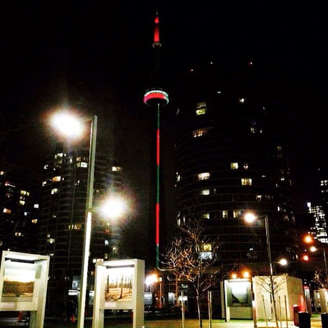 LOW ANGLE VIEW OF MODERN BUILDING AT NIGHT