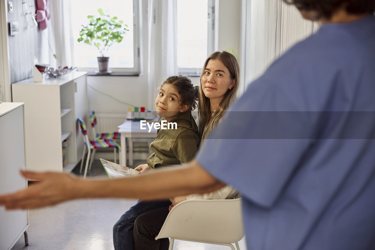 Mother and daughter in waiting room