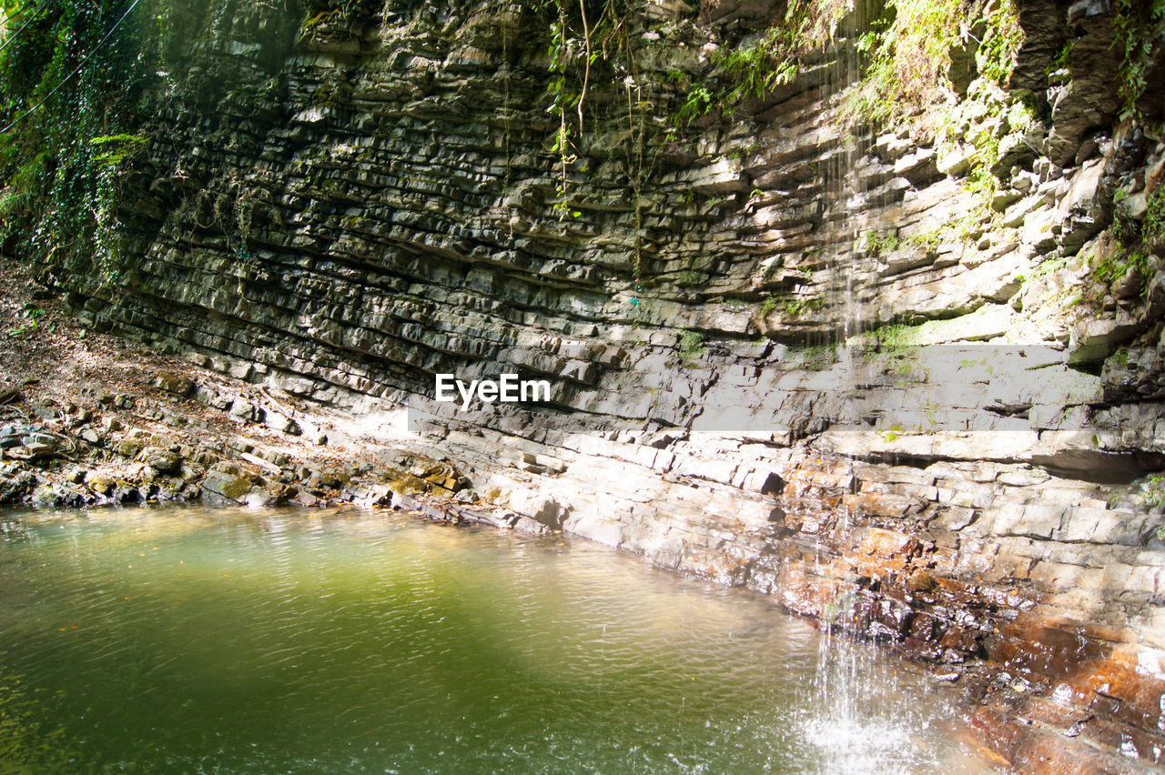 Scenic view of river amidst rocks