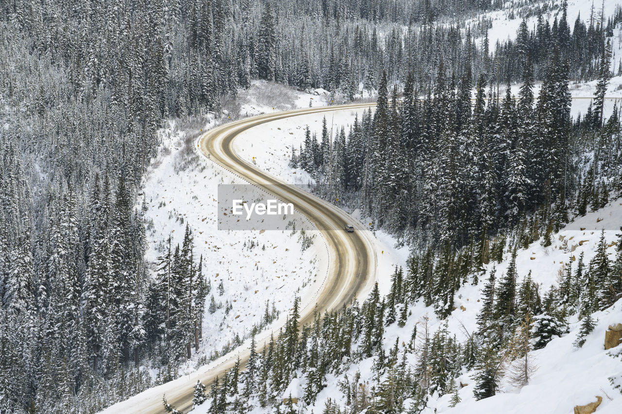 Car traveling on highway through a mountain pass