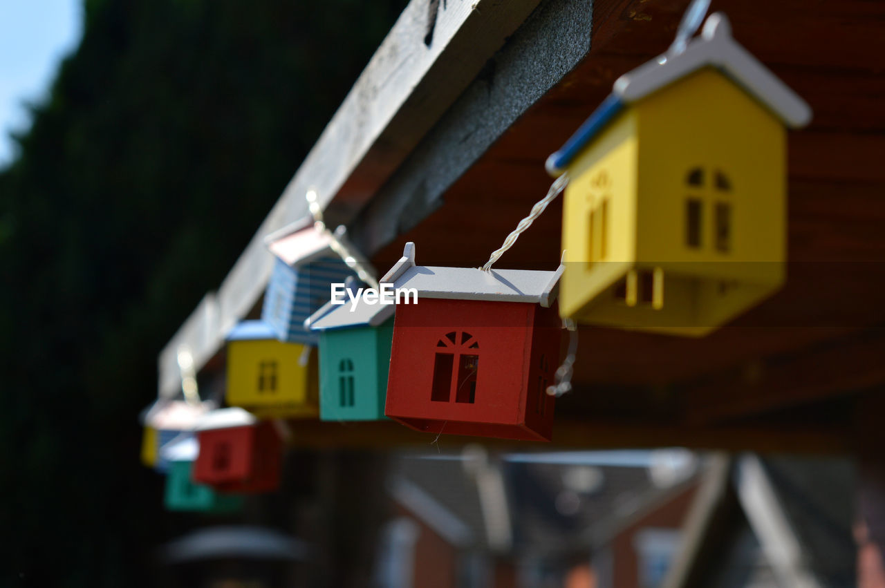 Low angle view of birdhouses