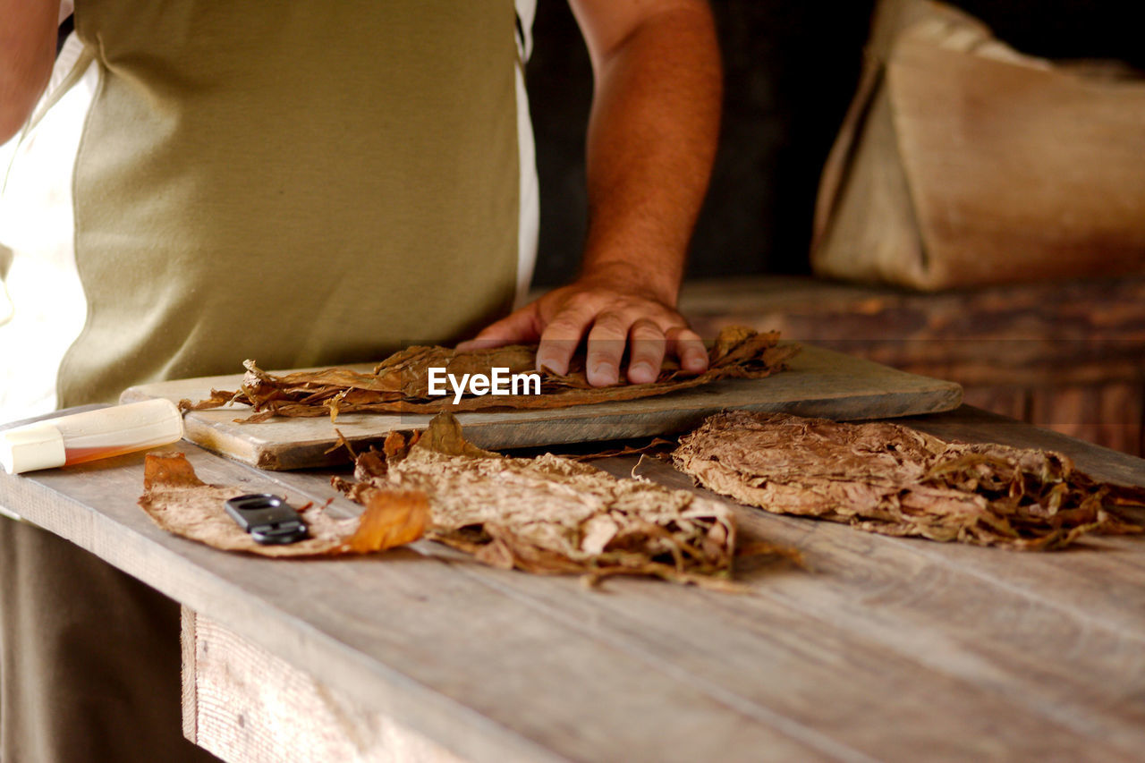 Making cuban cigars by hand in vinales, cuba.