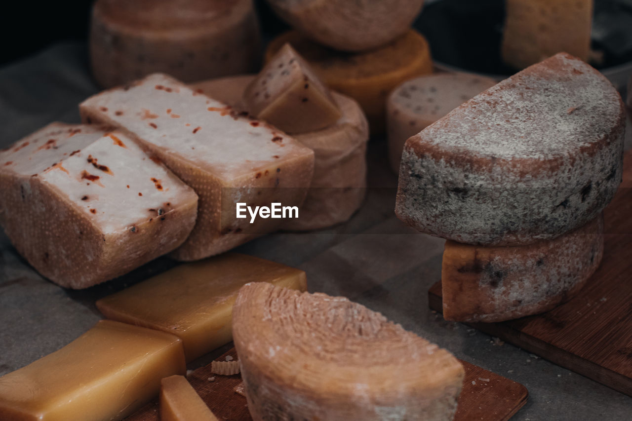 Various types of cheese on wooden table. toned photo. cheese background. rustic style