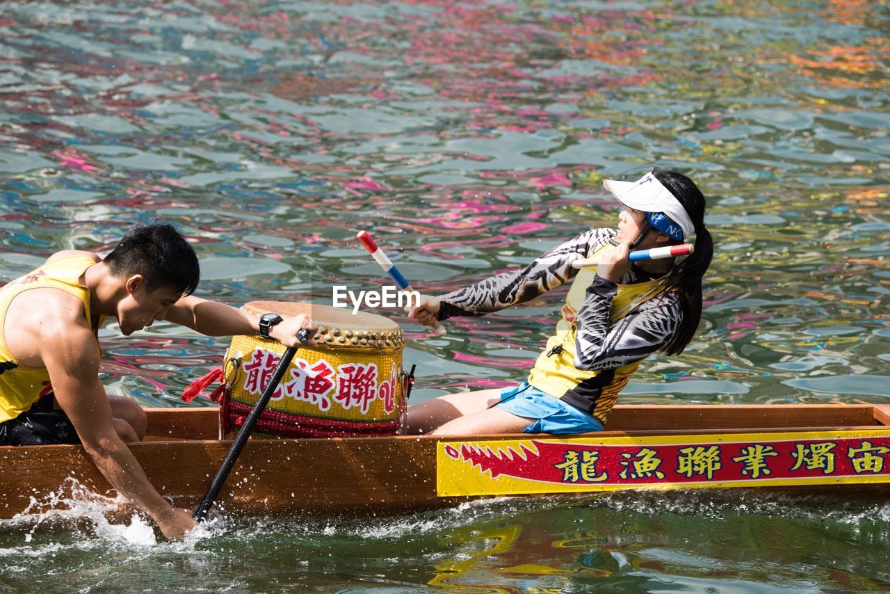 PEOPLE ON BOAT IN SEA