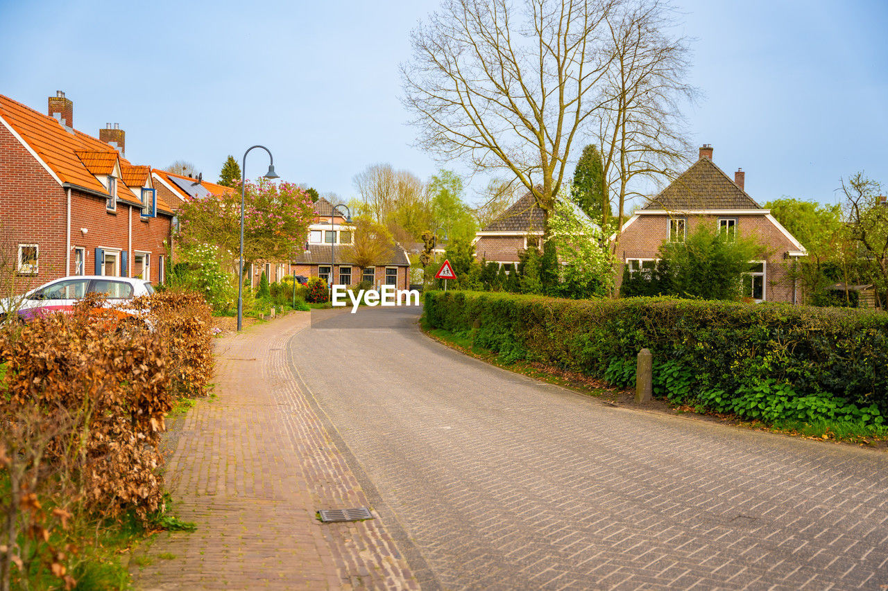 road amidst buildings in city