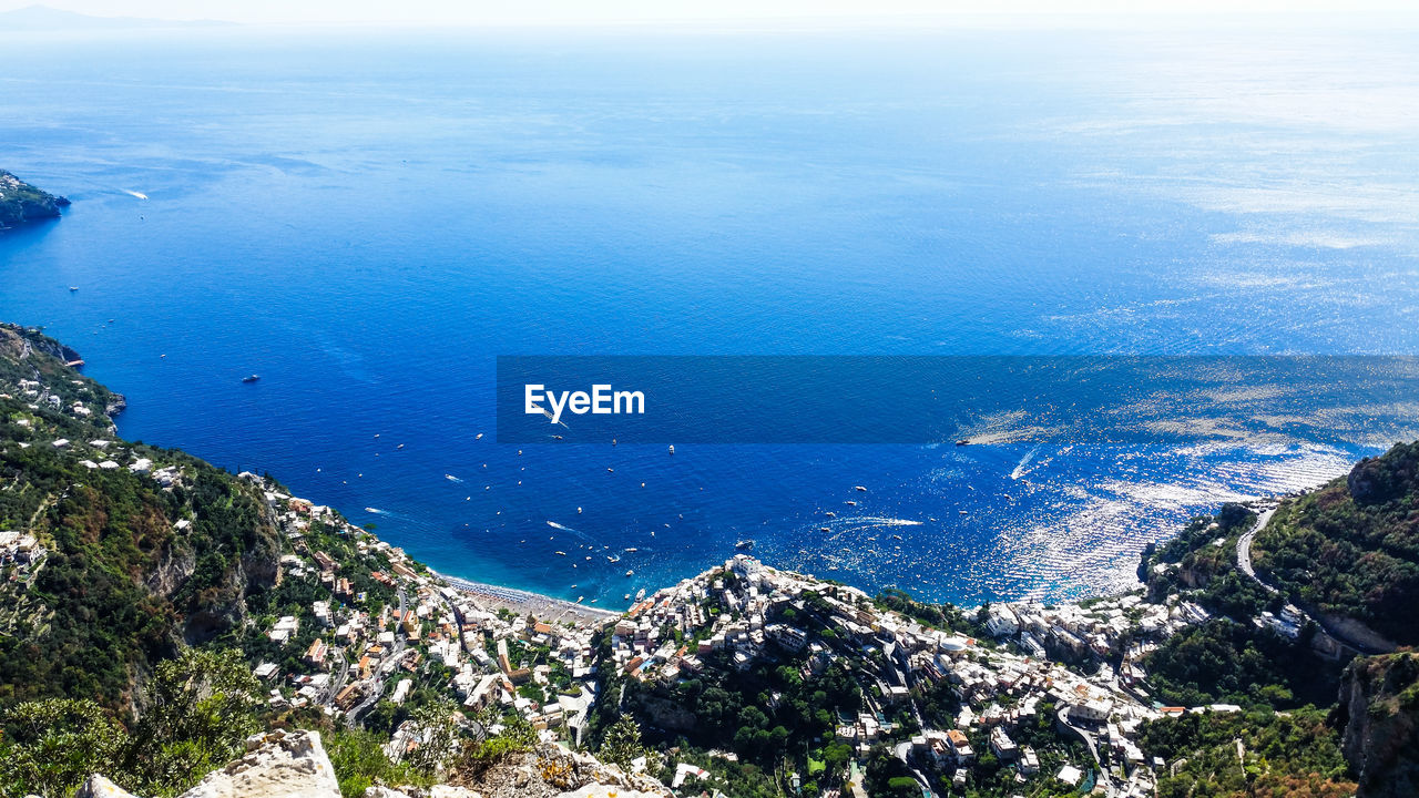 HIGH ANGLE VIEW OF SEA AND MOUNTAINS