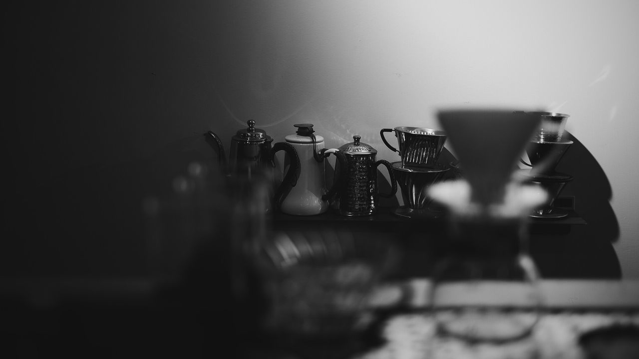 CLOSE-UP OF COFFEE ON TABLE IN ROOM