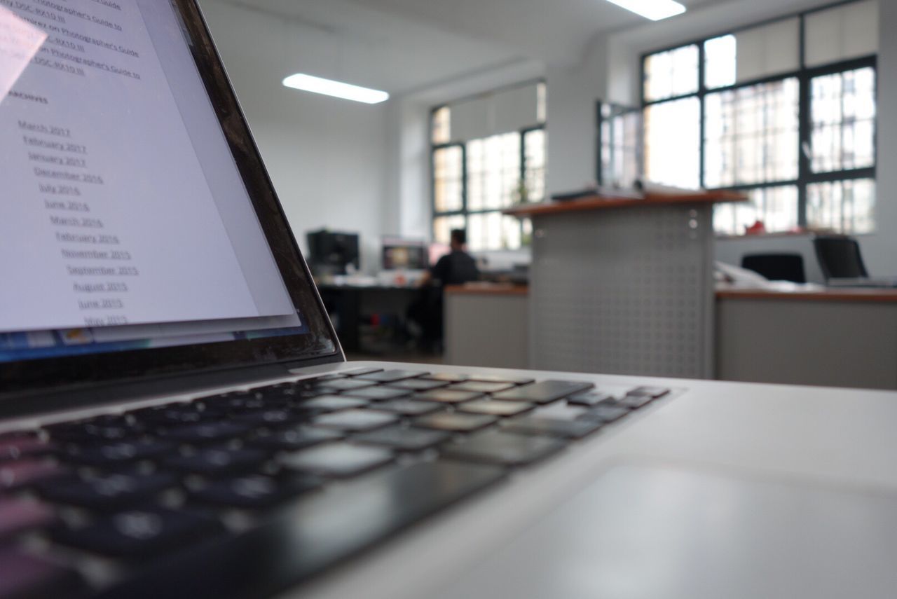 Close-up of laptop on desk at office