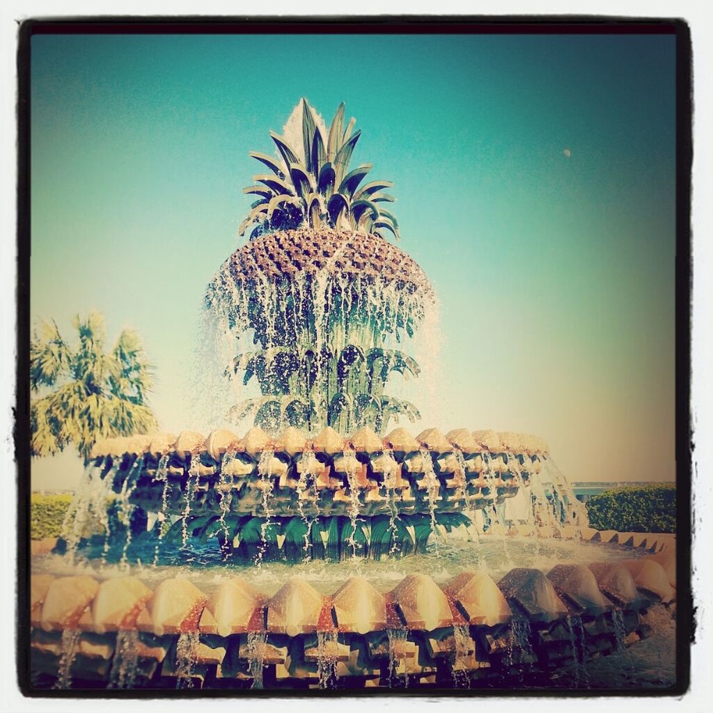 Pineapple shaped fountain against sky