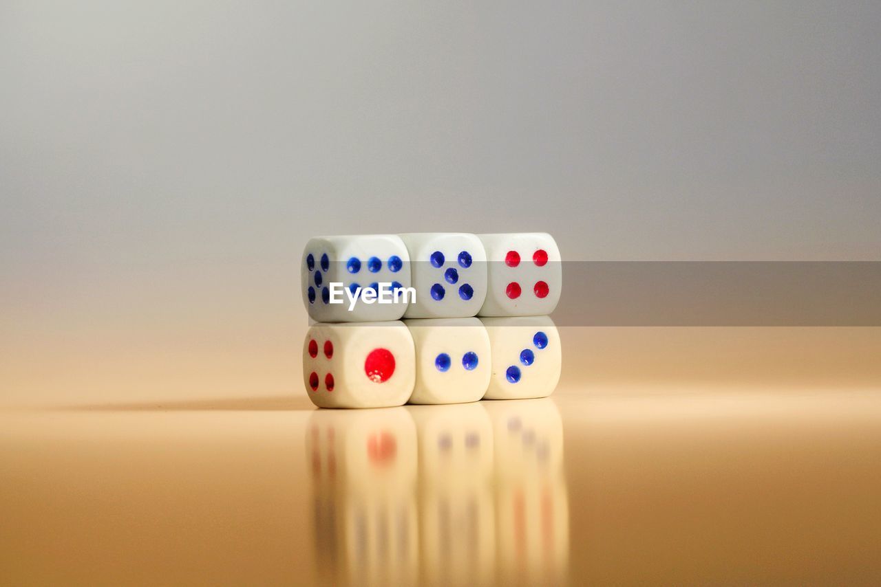 Close-up of dice stacked on table