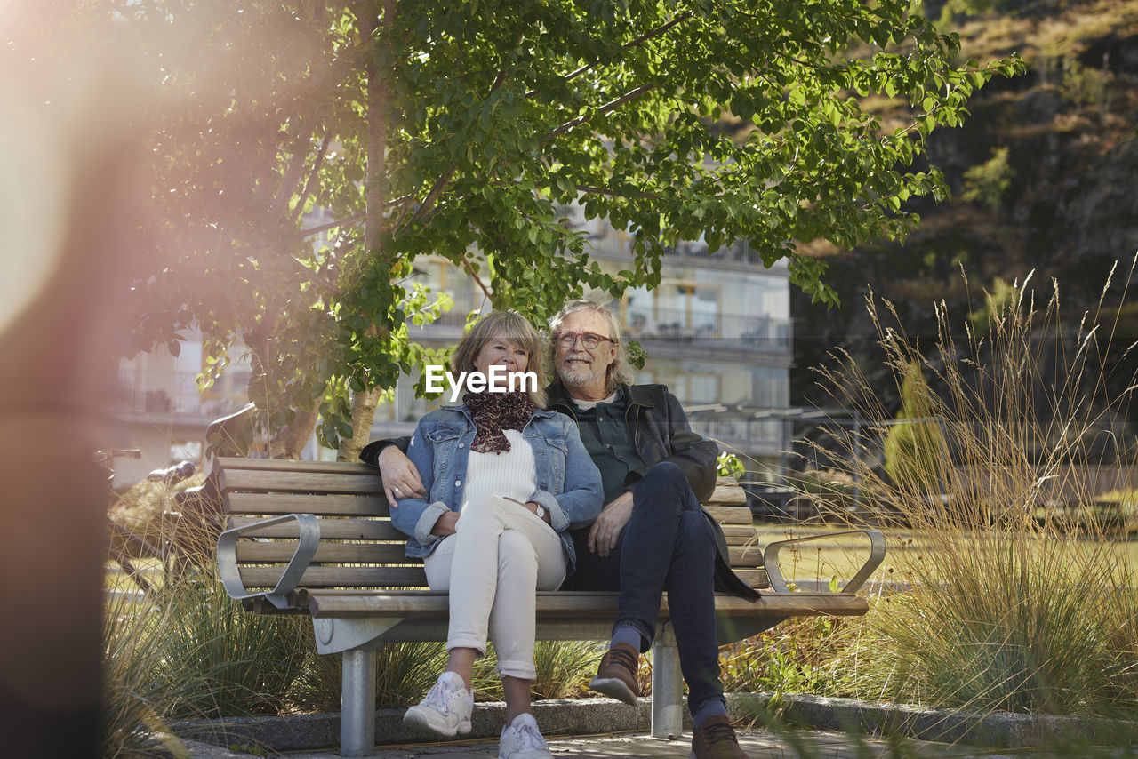 Mature couple relaxing on bench