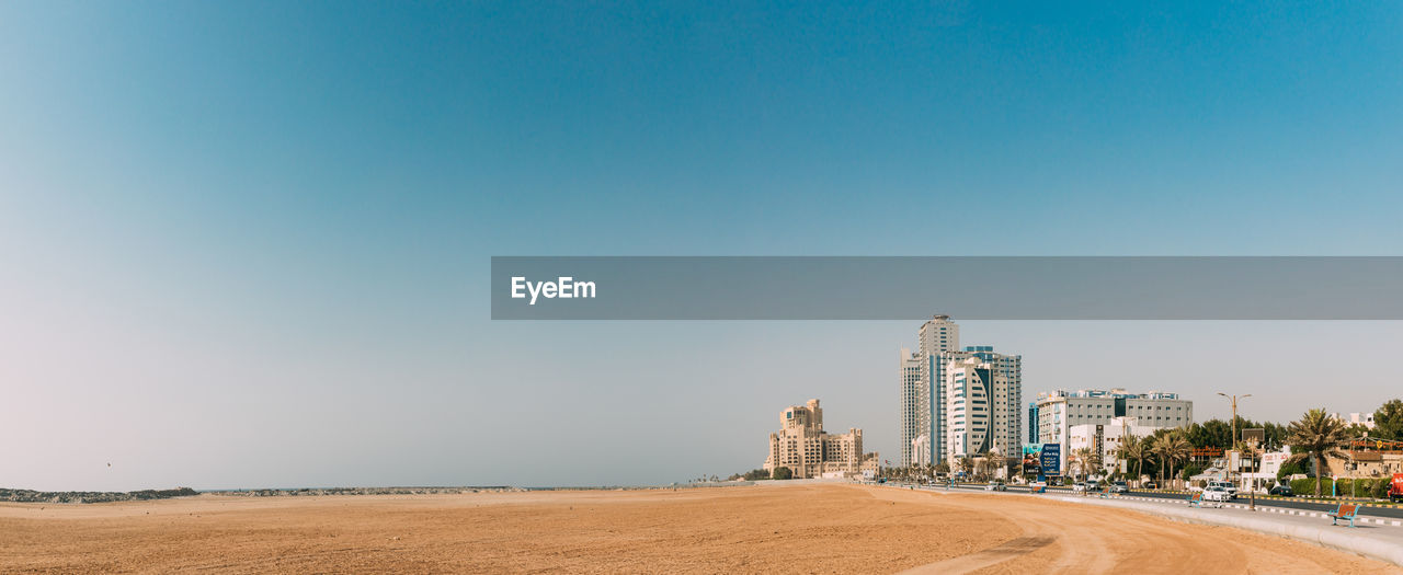 scenic view of beach against clear sky