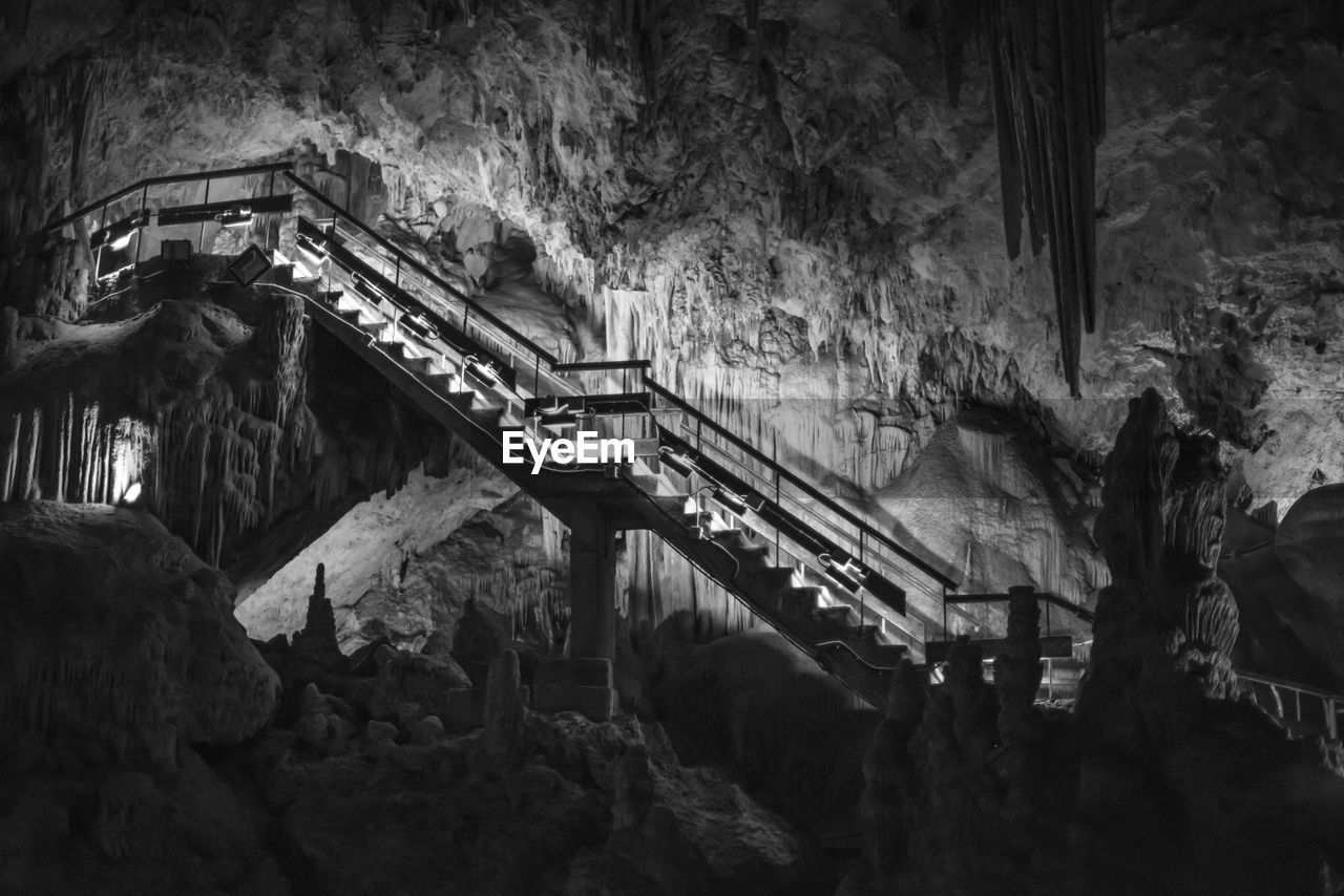 Low angle view of illuminated staircase in caves of nerja