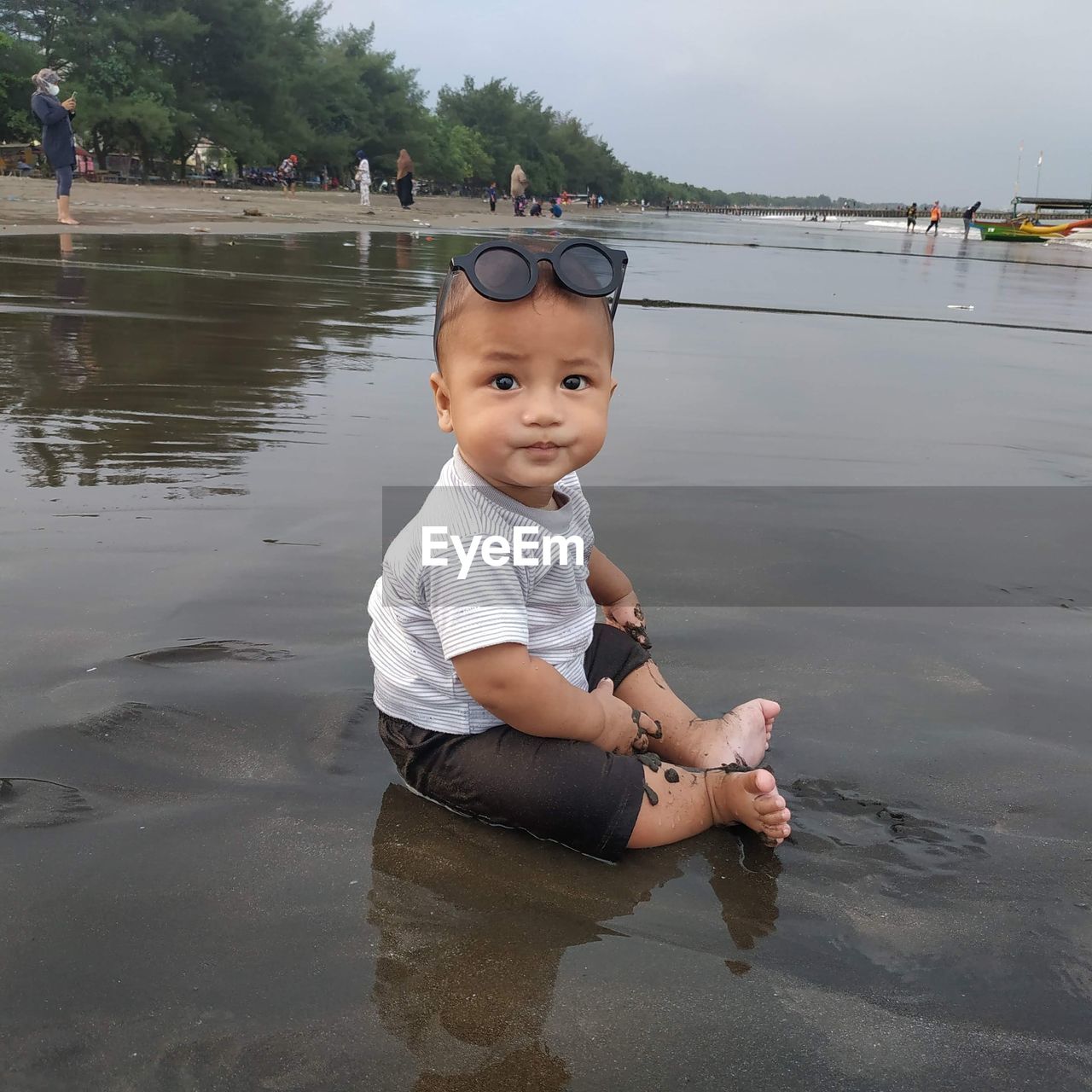 Full length of cute boy in water
