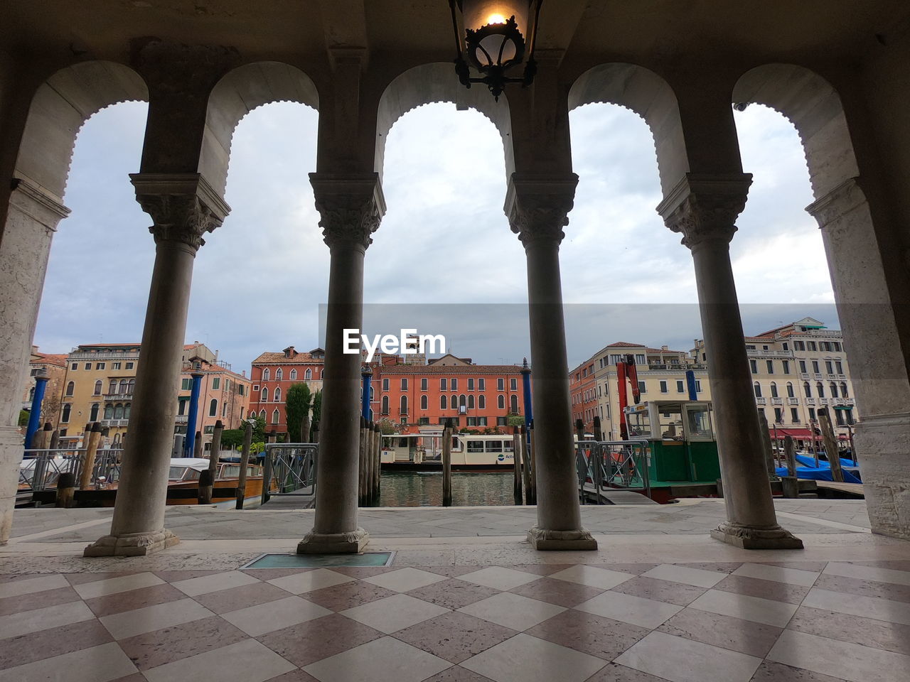 BUILDINGS SEEN THROUGH COLUMNS