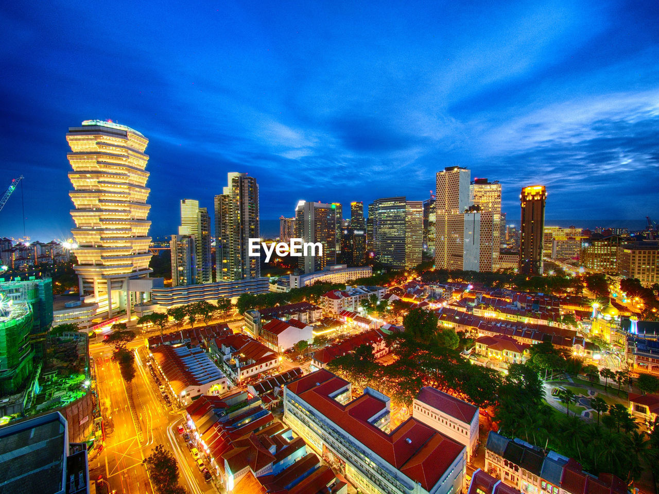 High angle view of city lit up at night