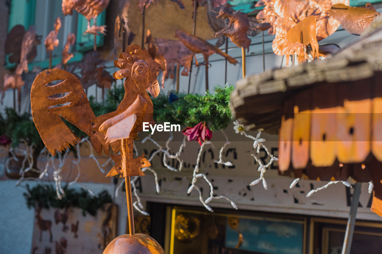 CLOSE-UP OF CLOTHES HANGING IN MARKET STALL