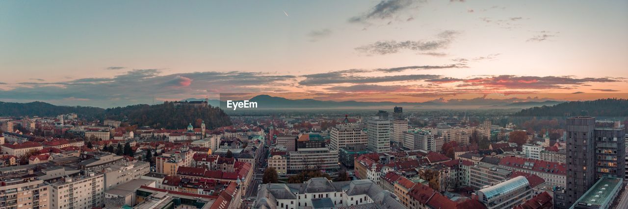 High angle shot of townscape against sky at sunset