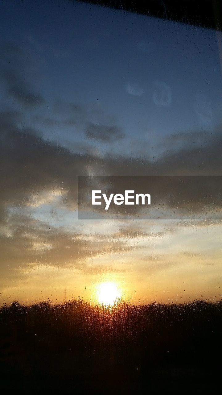 SCENIC VIEW OF SILHOUETTE LANDSCAPE AGAINST SKY DURING SUNSET