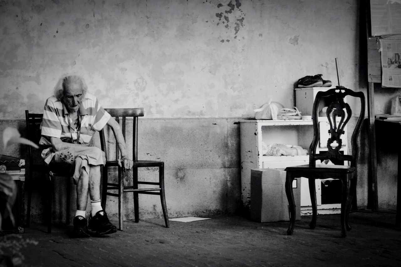 Man sitting on chair at home