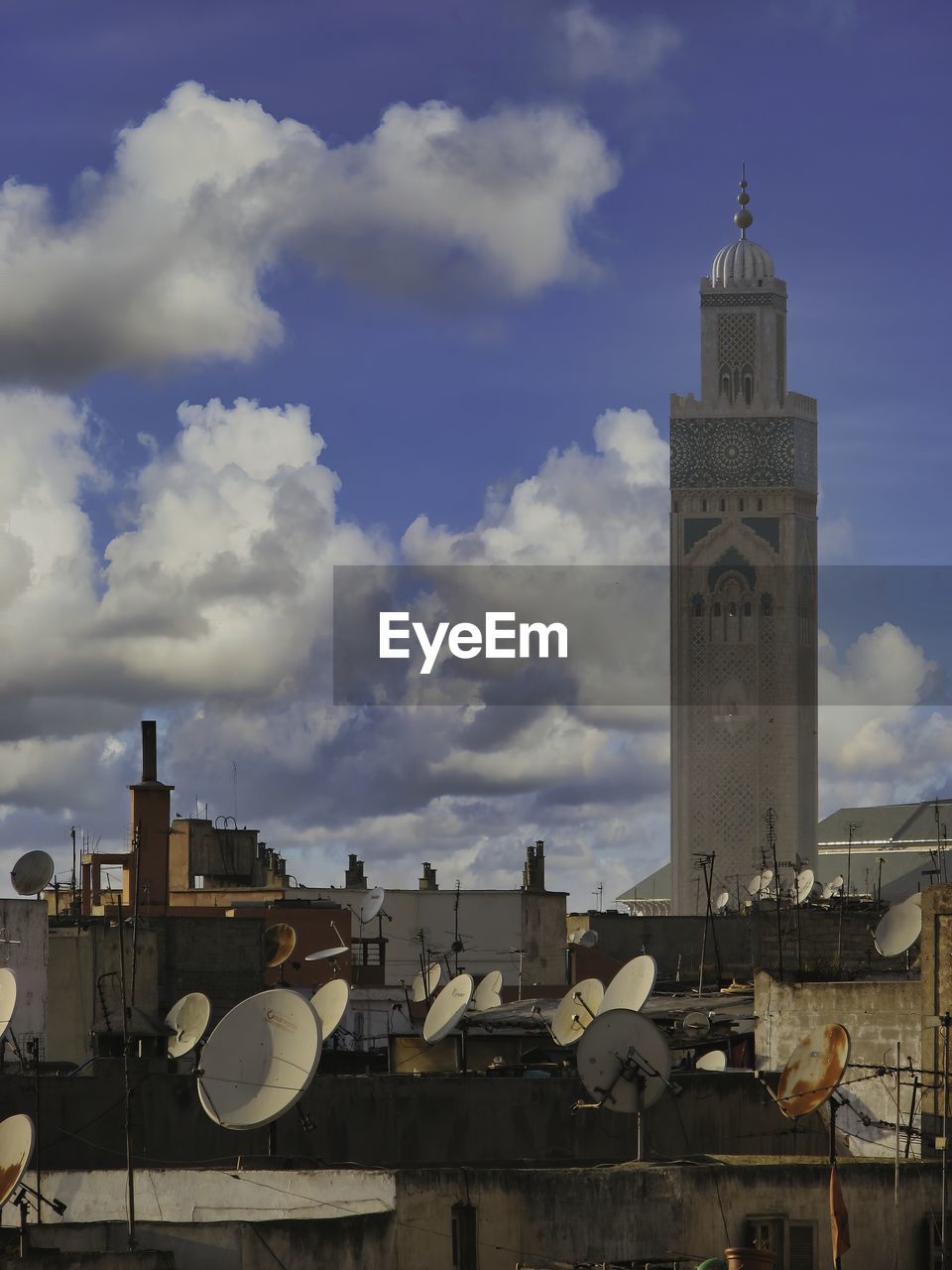 Casablanca mosque. view over rooftops showing satellite dishes.