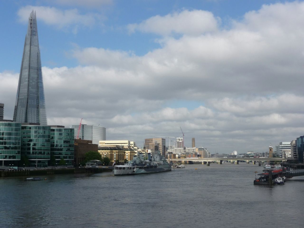 CITYSCAPE AGAINST CLOUDY SKY