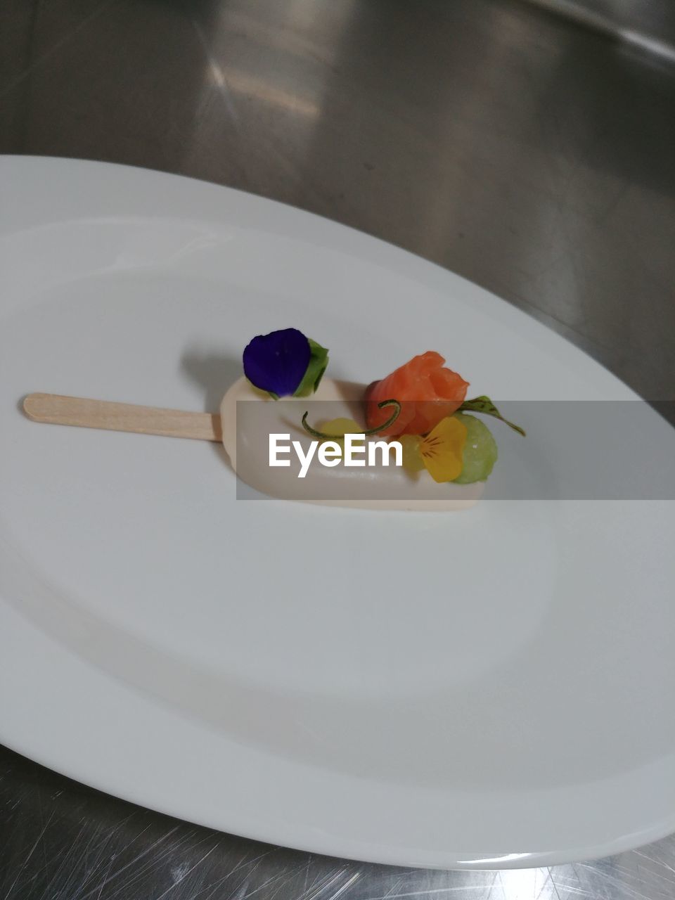 HIGH ANGLE VIEW OF SERVED IN PLATE ON TABLE