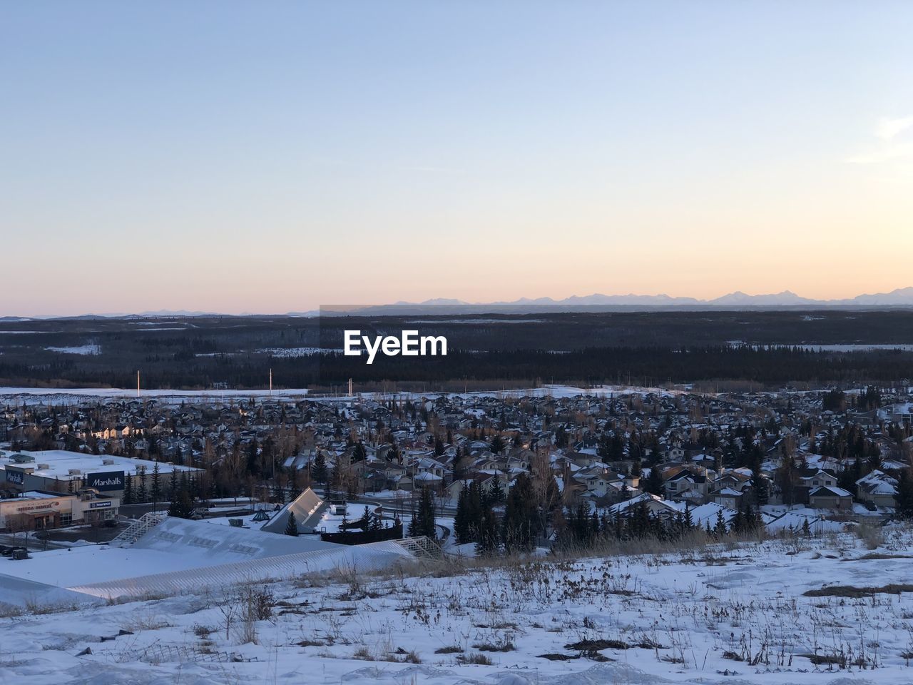 SCENIC VIEW OF SNOW COVERED FIELD AGAINST CLEAR SKY