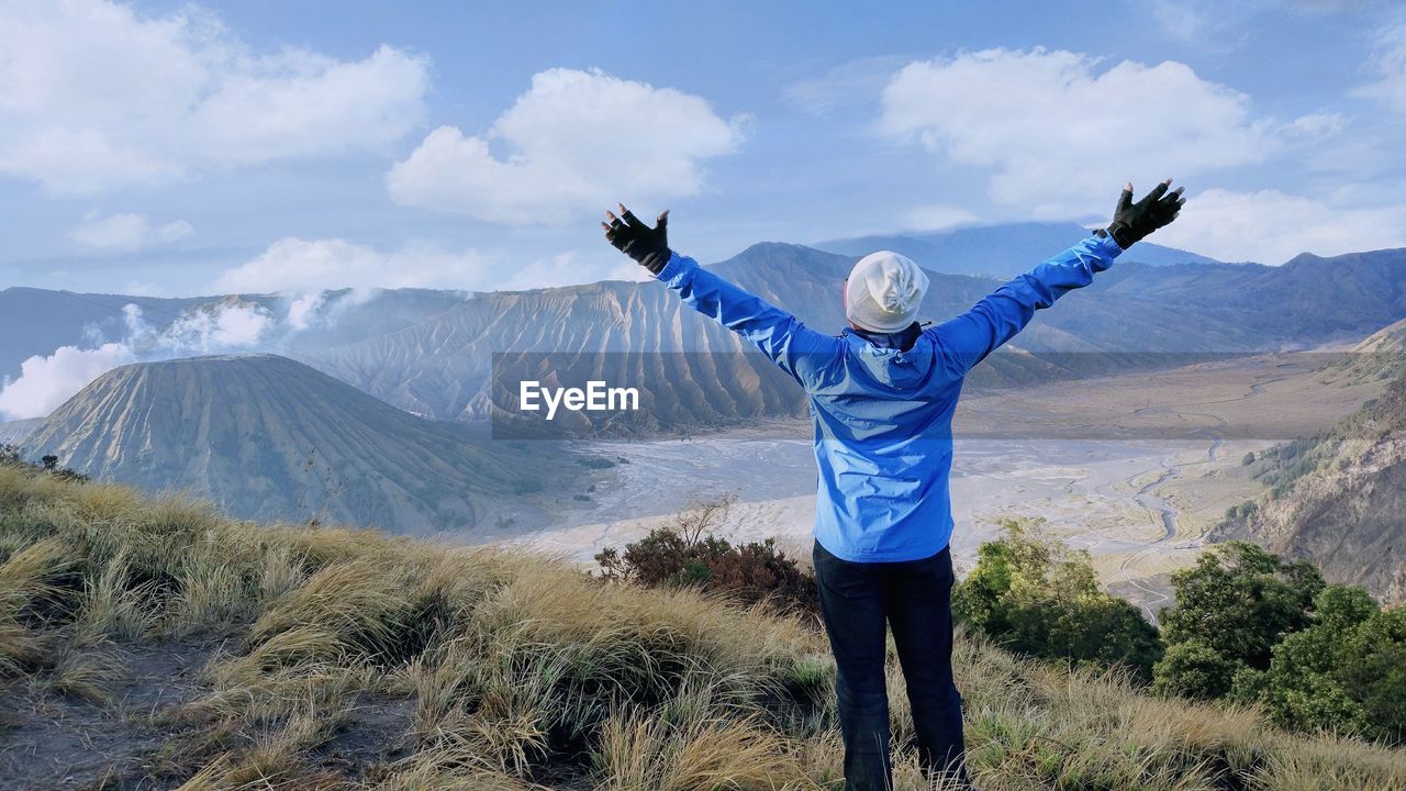 full length of woman standing on mountain