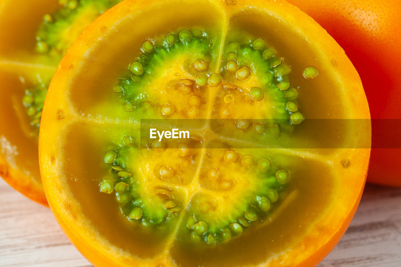 food and drink, healthy eating, food, fruit, wellbeing, freshness, slice, plant, produce, cross section, vegetable, no people, indoors, close-up, orange color, refreshment, citrus fruit, yellow, vitamin, organic, juicy, ripe, green, studio shot, drink, still life, nature