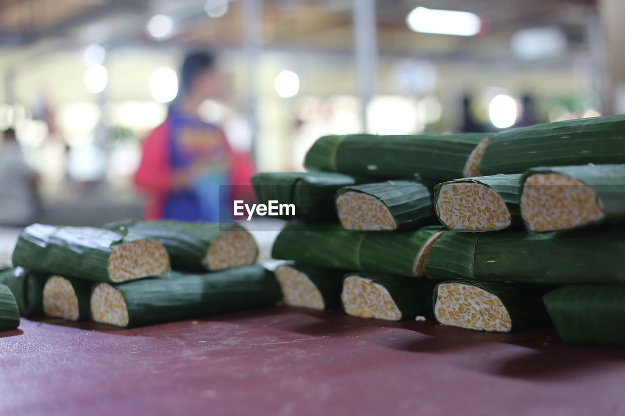 Close-up of food wrapped in banana leaves on table