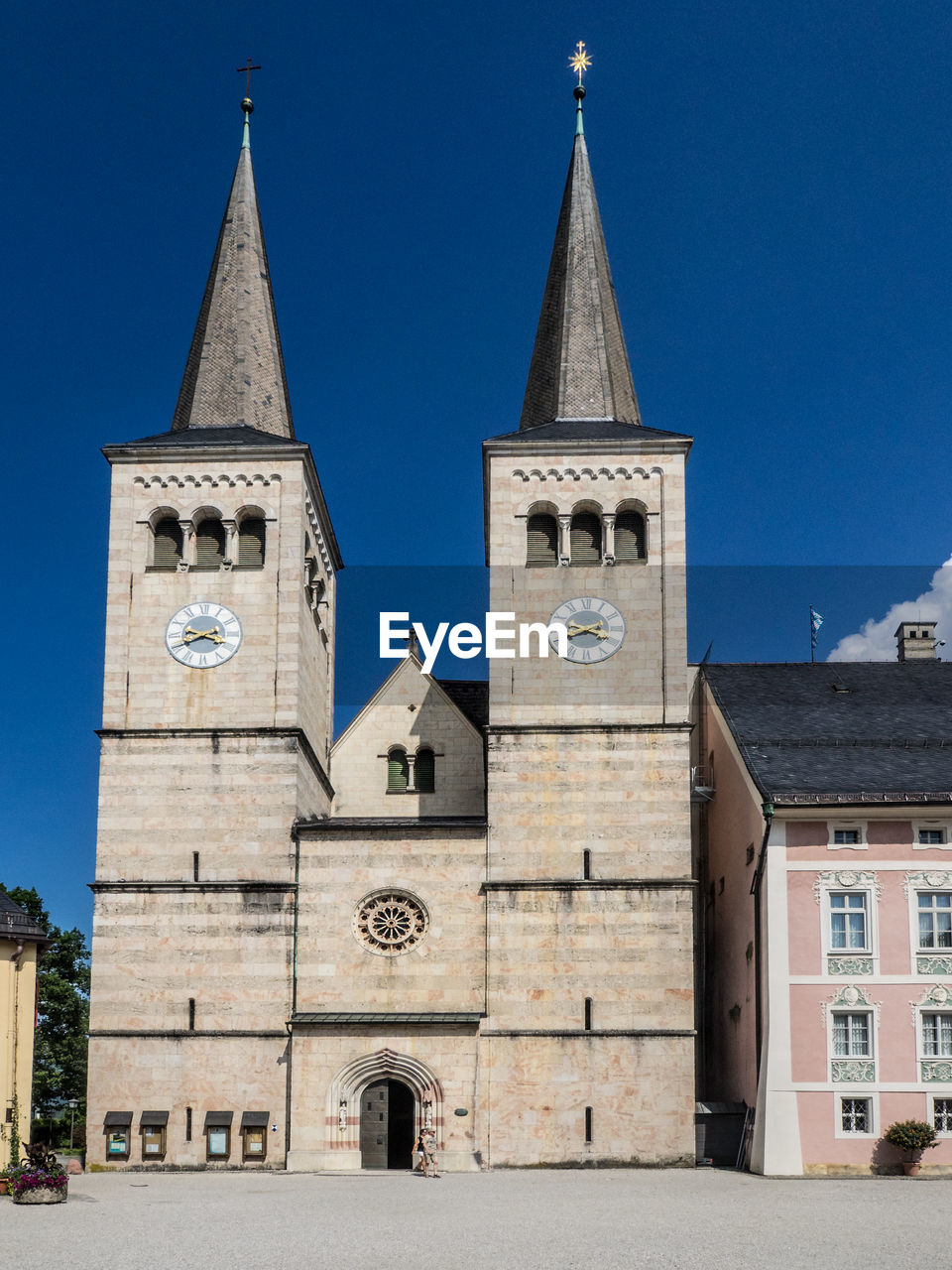 Clock towers of church against blue sky