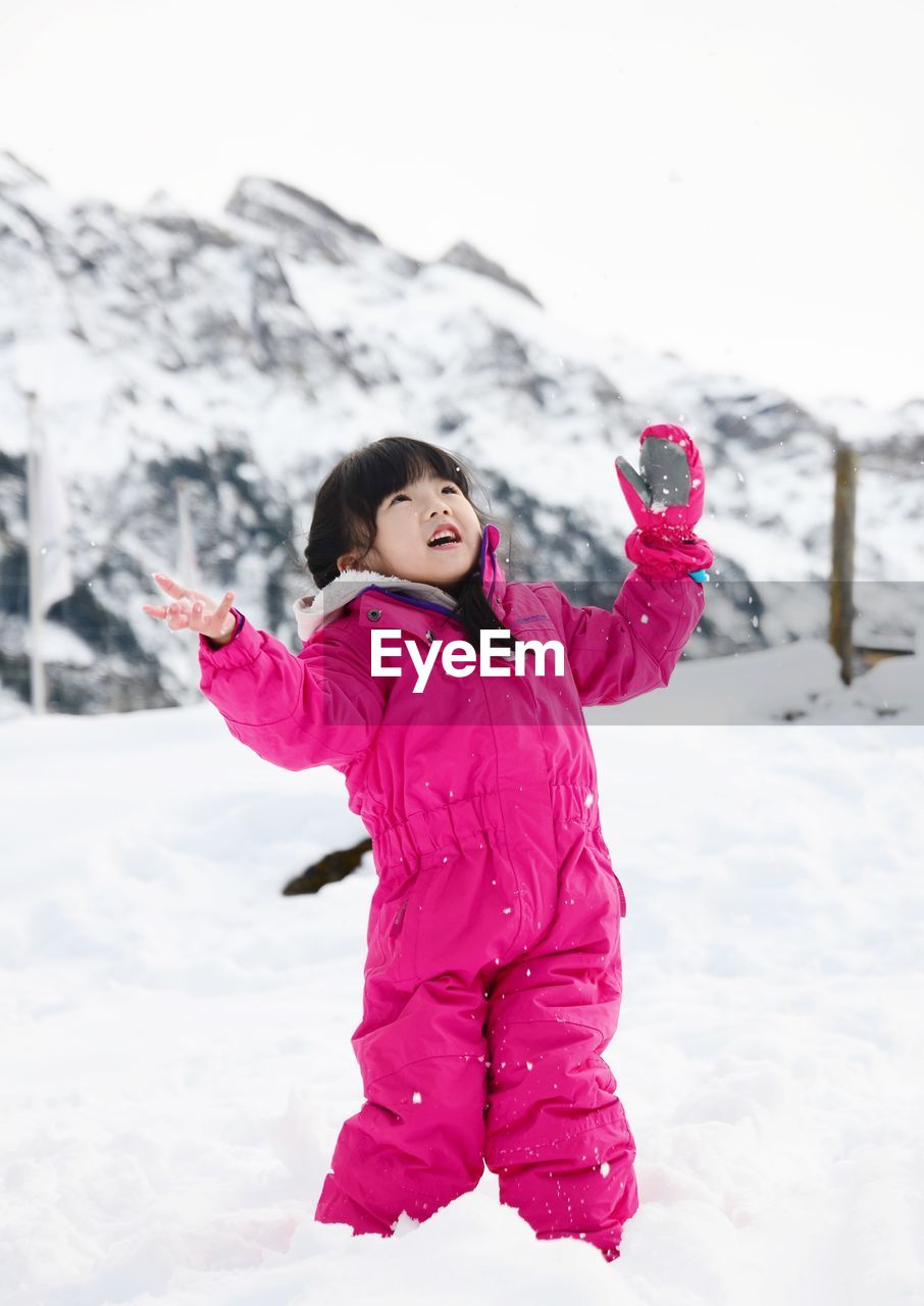 Portrait of girl standing in snow