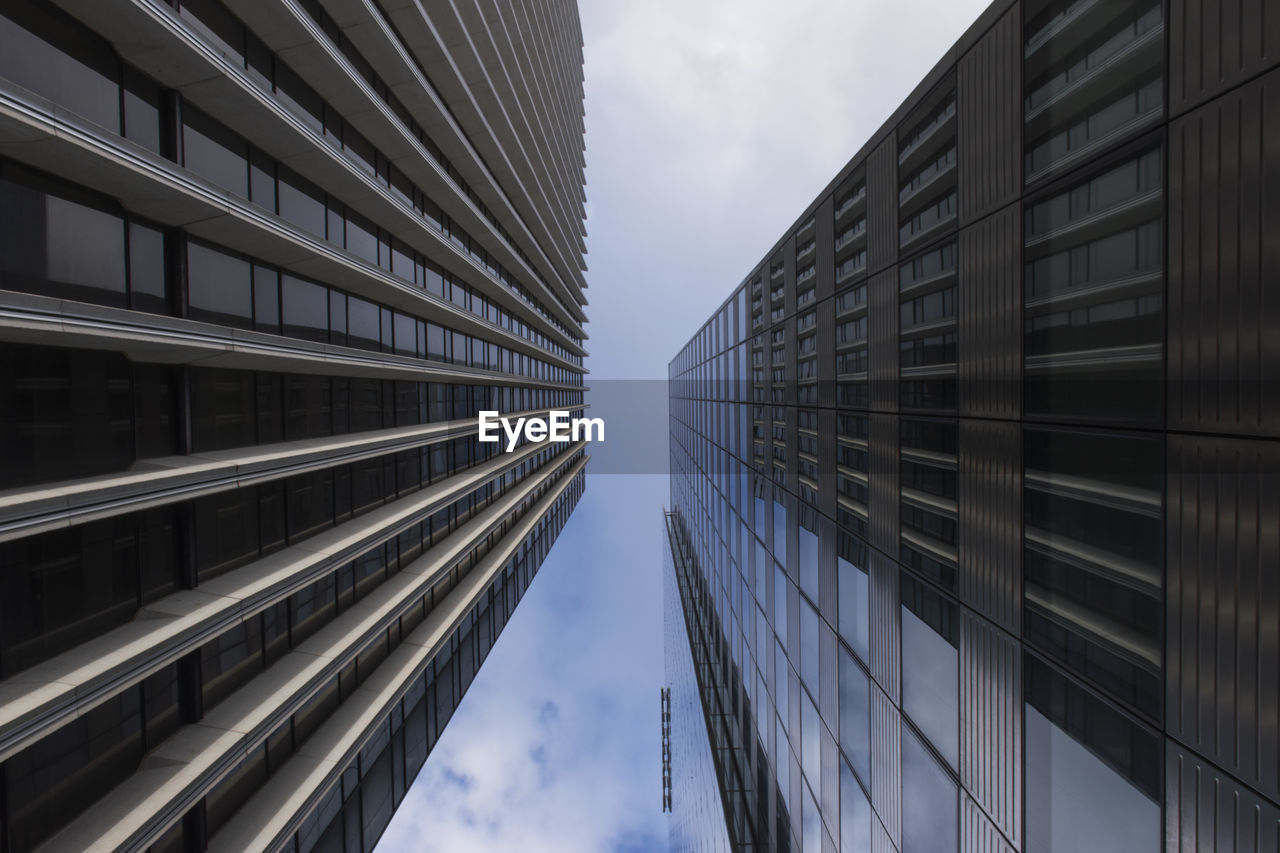 Low angle view of modern buildings against sky