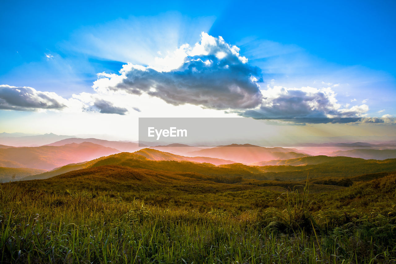 SCENIC VIEW OF LANDSCAPE AND MOUNTAINS AGAINST SKY