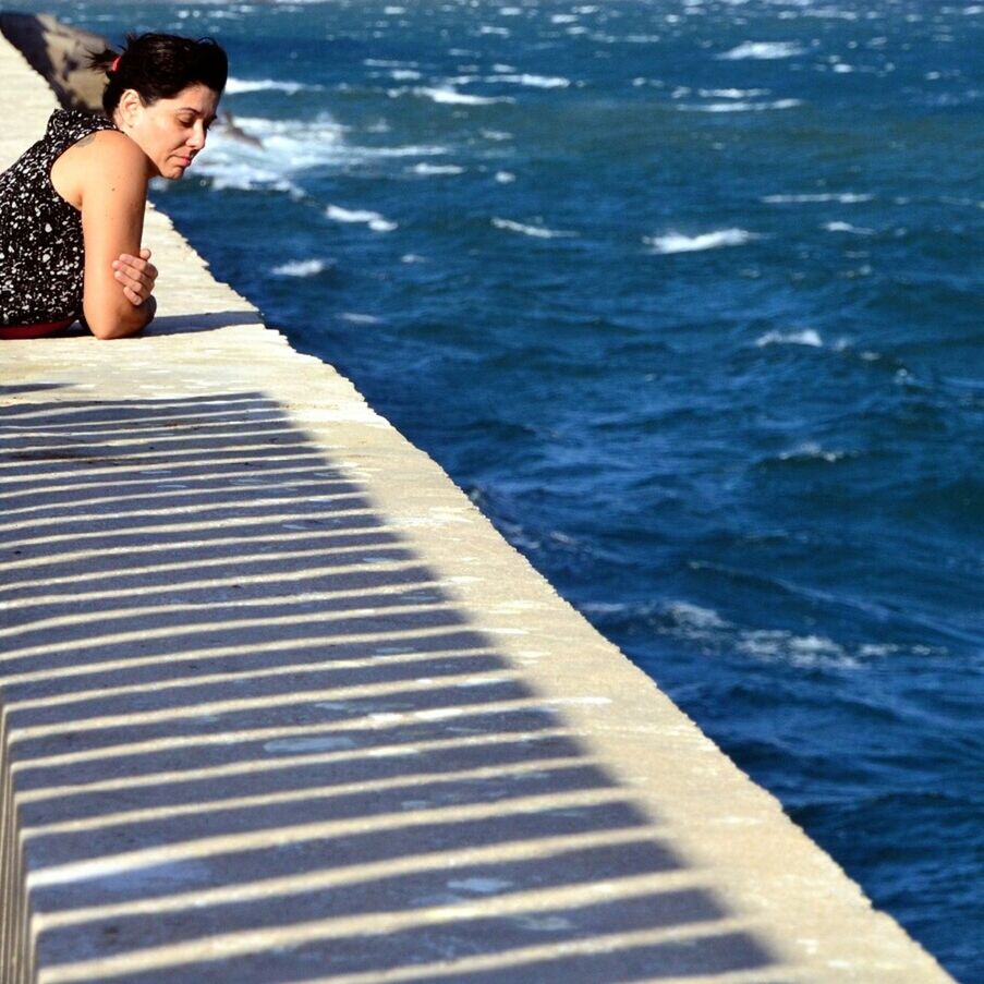 WOMAN RELAXING IN WATER