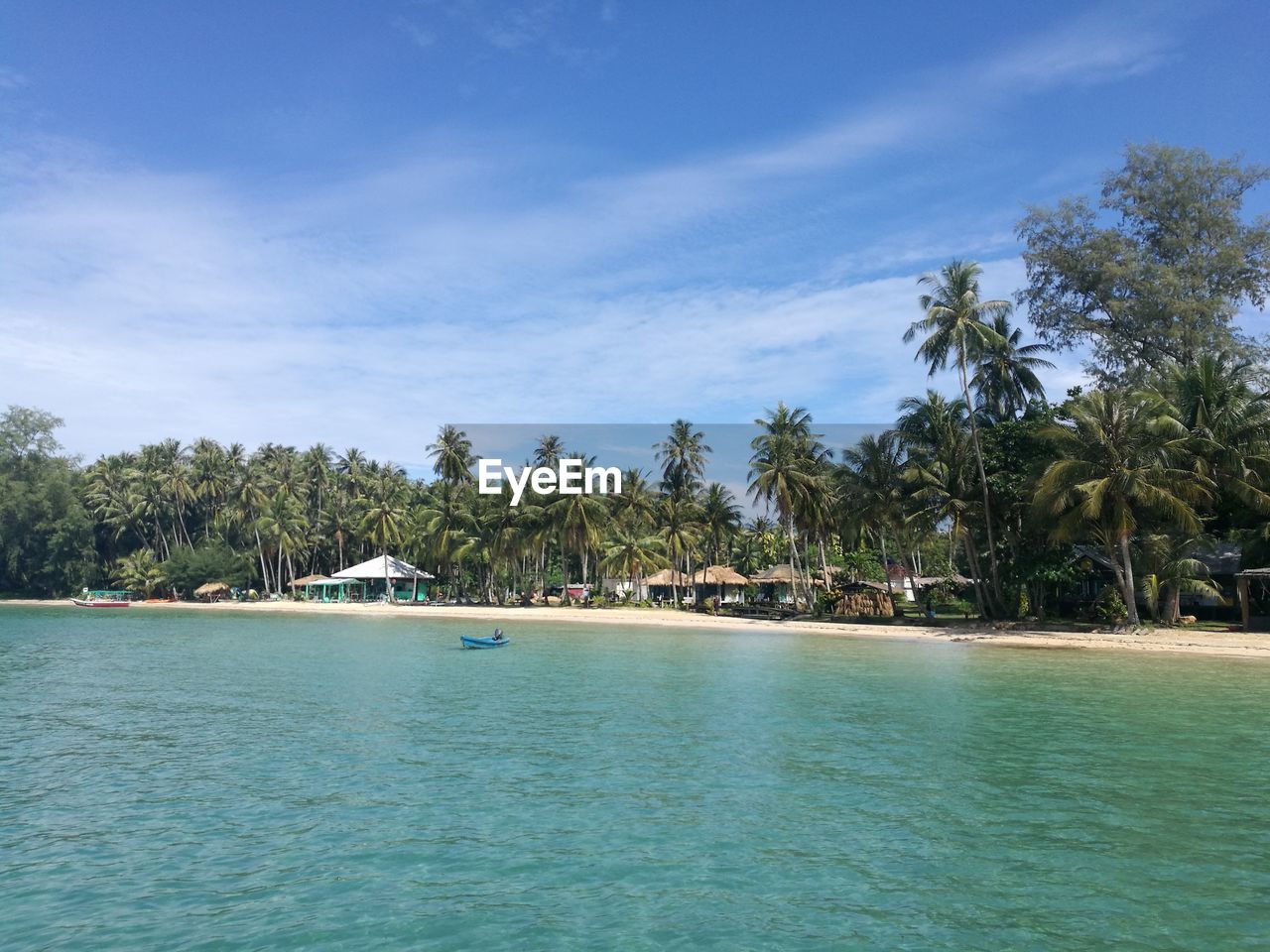 SCENIC VIEW OF SWIMMING POOL BY TREES AGAINST SKY